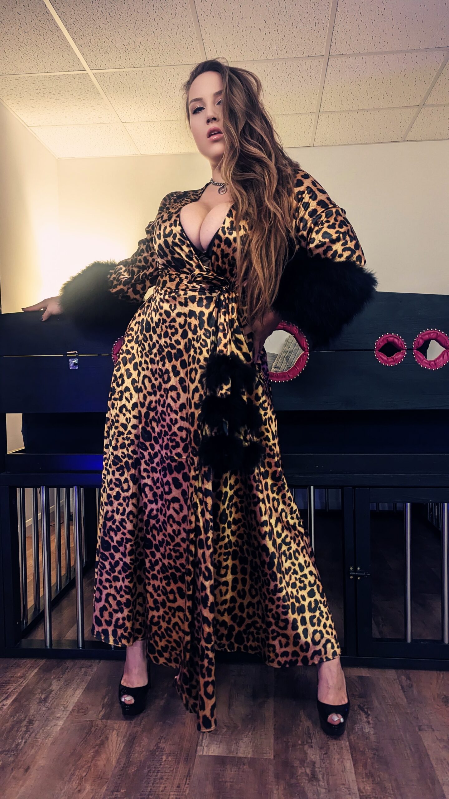 Panthera Valkyrie Natural dominant escort stands in leopard press in London dungeon